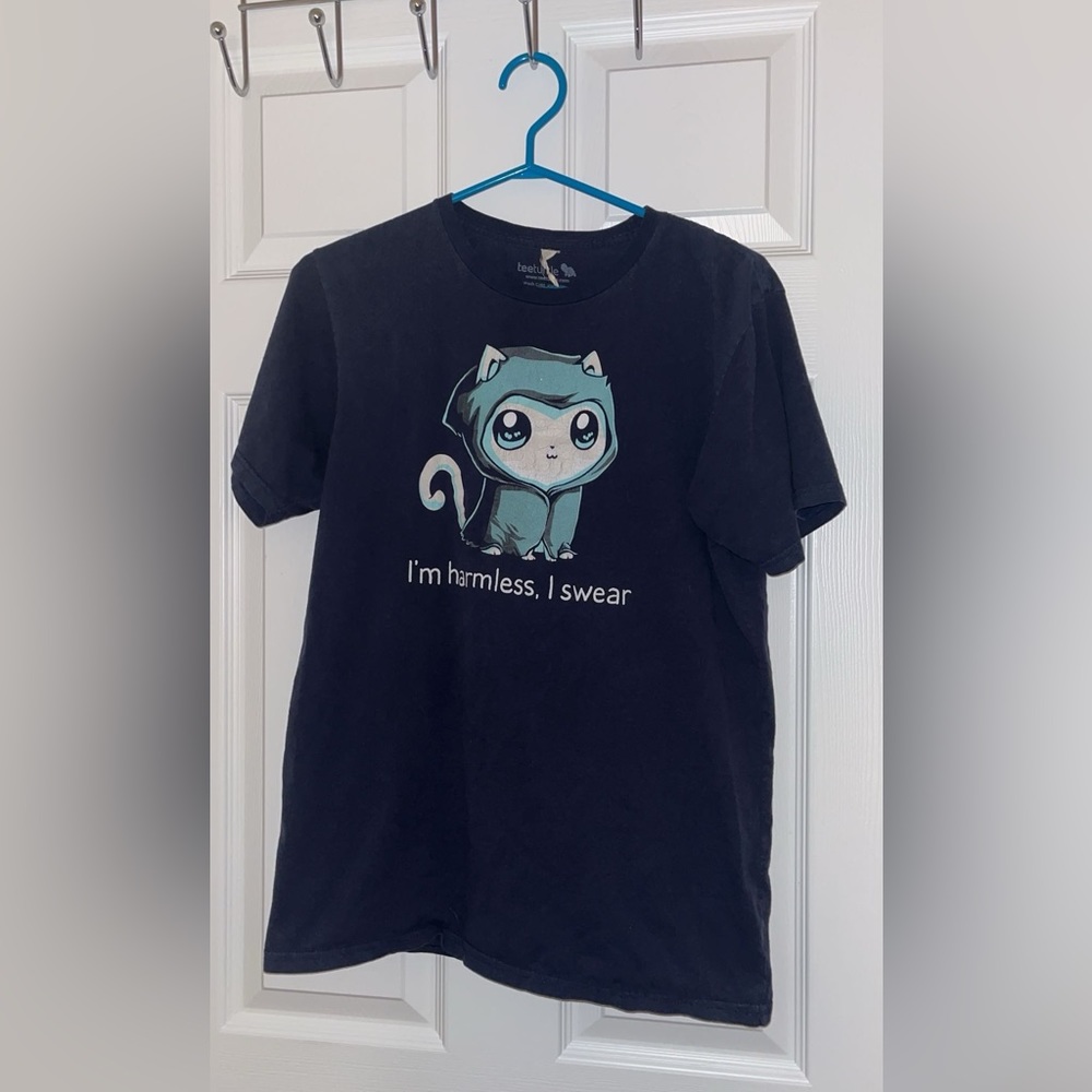 💀😸 Teeturtle ‘I’m harmless, I swear’ Grim Kitty Glow in the Dark T Shirt